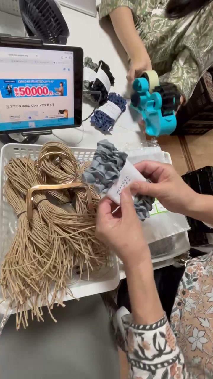 帯を巻いて仕上げる